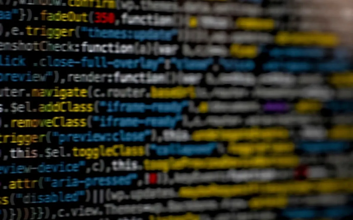 Syntax-highlighted code on a dark screen, shallow focus
