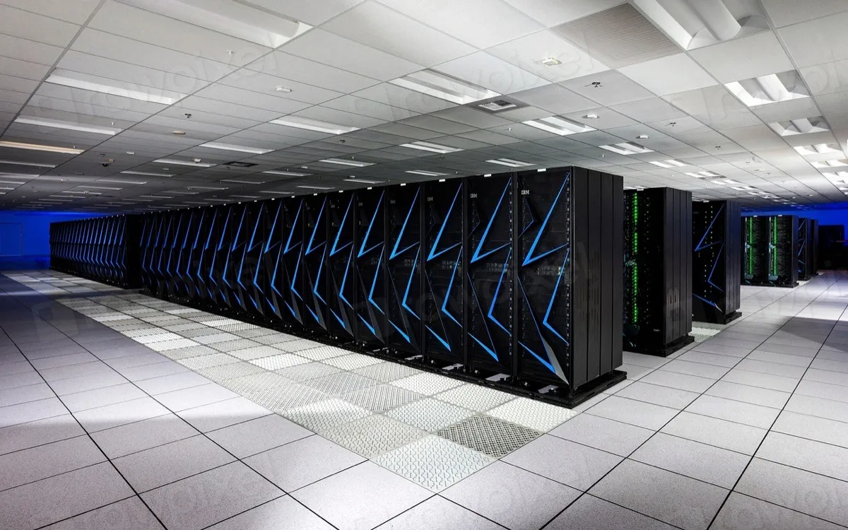 A long aisle of server racks in a data centre