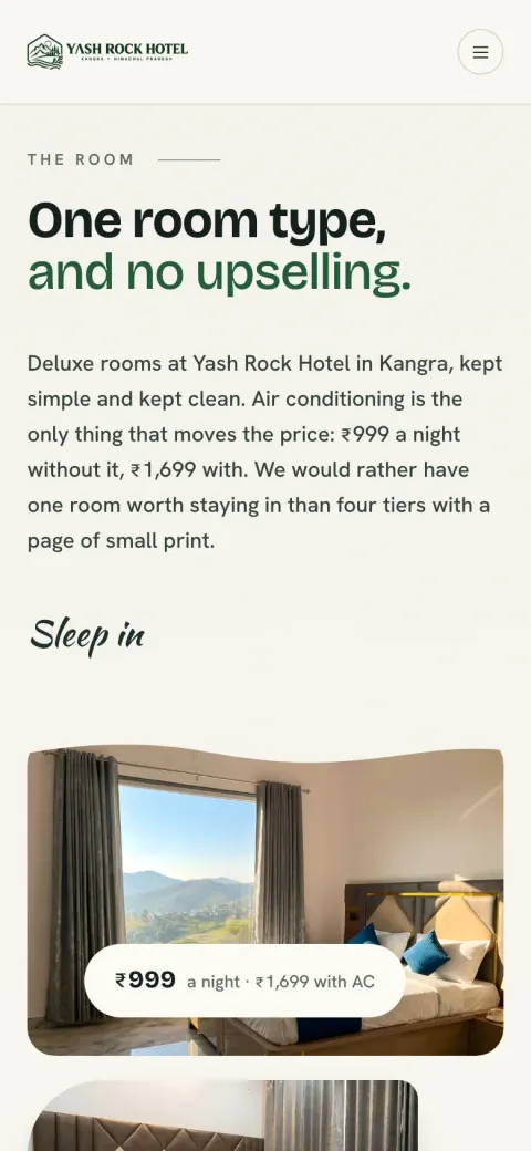 Yash Rock Hotel rooms page on a phone